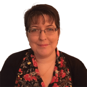 A person wearing a floral-patterned blouse and a black cardigan